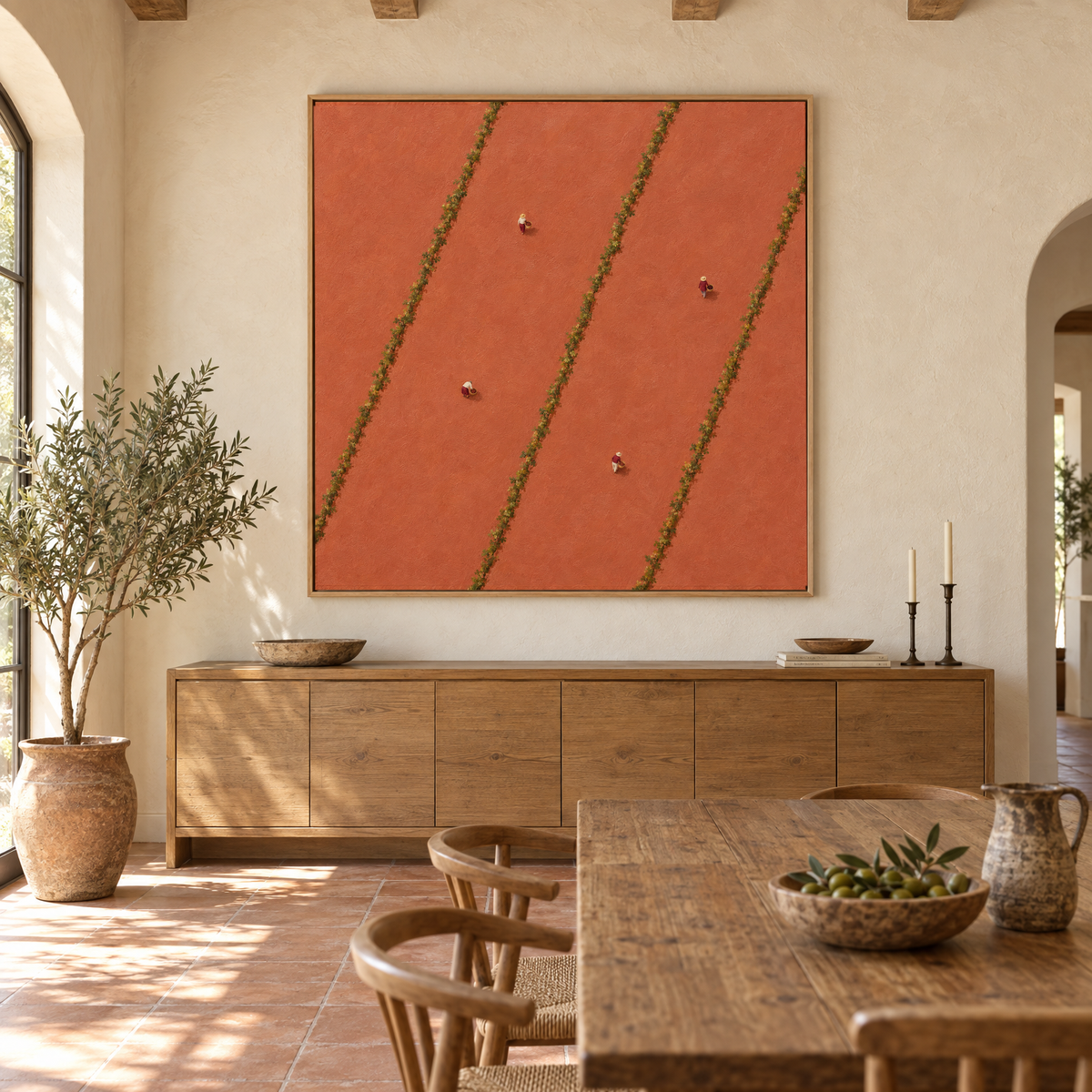 Oversized 72x72 inch aerial vineyard oil painting with tiny grape pickers between vine rows above a sideboard in a sunlit Mediterranean villa dining room