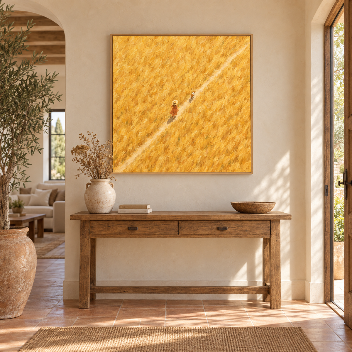 40x40 inch aerial oil painting of a woman in a straw hat walking a dog through a golden wheat field above a console table in a sunlit Mediterranean villa entryway